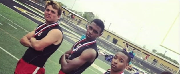 Derrick Hayes, left, and his 4x100 teammates were disqualified for a finger gesture — YouTube