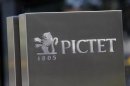 A sign bearing the logo of family owned private bank Pictet is pictured at company headquarters in Geneva