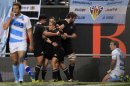 New Zealand All Blacks' Aaron Smith celebrates with teammates after he scored a try during their Rugby Championship match against Argentina Los Pumas in La Plata