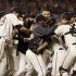 The San Francisco Giants celebrate after the final out in Game 7 of baseball's National League championship series against the St. Louis Cardinals Monday, Oct. 22, 2012, in San Francisco. The Giants won 9-0 to win the series. (AP Photo/David J. Phillip)