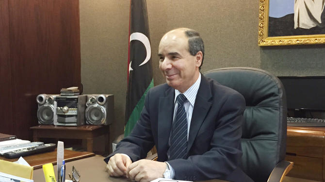 Ibrahim Dabbashi, Libya&#39;s United Nations ambassador, participates in an interview, Friday, May 8, 2015 in New York. Dabbashi is largely rejecting a European Union plan to fight the growing migrant crisis by seizing smuggling ships in Libya’s territorial waters. Dabbashi made it clear that his government has been left out of the urgent discussion of the migrant crisis, with thousands of people from the Middle East and Africa setting off from Libya’s shore for Europe and many dying at sea. (AP Photo/Cara Anna)