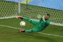 Brazil's goalkeeper Weverton Pereira da Silva makes a save during the penalty shoot-out of the Rio Olympic Games men's football gold medal match on August 20, 2016