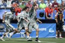 Loyola lacrosse players, including Greg Catalano, center, rush the field after defeating Maryland 9-3 in the Division I NCAA men's lacrosse championship game at Gillette Stadium in Foxborough, Mass., Monday, May 28, 2012. (AP Photo/Gretchen Ertl)