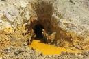 Yellow mine waste water is seen at the entrance to the Gold King Mine in San Juan County, Colorado