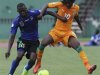 Ivory Coast's Kouassi fights for the ball with Tanzania's Nditi during their World Cup qualifier soccer match in Abidjan