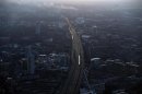 Commuter trains are seen at dawn on the approach to London Bridge rail station in an aerial photograph from The View gallery at the Shard, western Europe's tallest building, in London