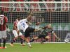 Atalanta's Cigarini shoots to score against AC Milan during their Serie A soccer match at the San Siro stadium in Milan