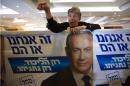 A supporter leans over a poster of Israeli Prime Minister and Likud party leader at a Jerusalem hotel on February 8, 2015