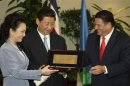 China's President Xi Jinping and his wife Liyuan receive the Keys to the City from San Jose Mayor Johnny Araya in San Jose