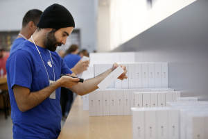 Apple employee grabs an iPhone 6 for a customer inside&nbsp;&hellip;