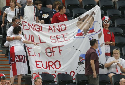 England fans wait for the start of their team's Group D Euro 2012 soccer match against Ukraine at the Donbass Arena in Donetsk