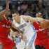 Denver Nuggets forward Danilo Gallinari, right, of Italy, works the ball inside against Los Angeles Clippers center DeAndre Jordan in the first quarter of  an NBA basketball game in Denver, Thursday, March 7, 2013. (AP Photo/David Zalubowski)