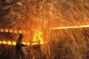 A labourer works at a steel factory in Dalian