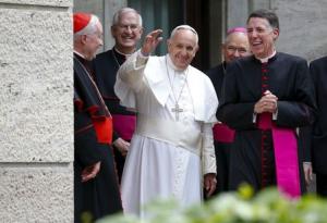 Pope Francis waves as he leaves after celebrating a mass at the North American College in Rome