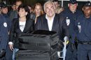 Former IMF chief Strauss-Kahn and wife Sinclair arrive at Charles-de-Gaulle airport in Roissy near Paris