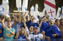 In this Wednesday, May 27, 2015 photo, Brazil's Cruzeiro fans cheer prior to a Copa Libertadores quarter finals soccer match against Argentina's River Plate in Belo Horizonte, Brazil. (AP Photo/Andre Penner)