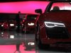 A staff cleans cars on the Audi stand ahead of the 83rd Geneva Car Show at the Palexpo Arena in Geneva