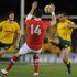 Australia's Will Genia from (right) kicks the ball during the second Test against Wales