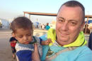 This undated family handout photo shows British man Alan Henning, currently held hostage by Islamic State (IS) and whose life was threatened in the IS video in which they beheaded David Haines. British officials have dropped efforts to prevent the naming of hostage Alan Henning. Henning is the hostage threatened in the latest Islamic State video, which announced the beheading of hostage David Haines. In the video, Henning is shown briefly on camera and also threatened with death. British officials and Henning's family had asked the press not to publish his name out of concern for his safety, but that request was dropped Sunday afternoon. Britain's prime minister says Islamic State terrorists pose a "massive" security threat that cannot be ignored. David Cameron says the extremists who beheaded two American journalists and now a British aid worker "are not Muslims, they are monsters." (AP Photo/PA Wire) UNITED KINGDOM OUT - NO SALES - NO ARCHIVES