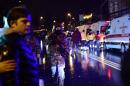 Turkish special force police officers and ambulances are seen at the site of an armed attack January 1, 2017 in Istanbul
