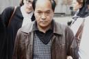 File photo of Diran Lin, father of victim Jun Lin, leaving the morning session of the preliminary hearing of suspect Luka Rocco Magnotta in Montreal