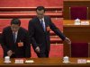 Chinese President Xi Jinping, left, and Premier Li Kiqiang, right,  get to their seats during a plenary session of the NPC held in Beijing's Great Hall of the People, China, Saturday, March 16, 2013. China’s new leaders turned Saturday to veteran technocrats with greater international experience to staff a Cabinet charged with overhauling a slowing economy and pursuing a higher global profile without triggering opposition. (AP Photo/Alexander F. Yuan)