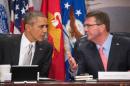 US President Barack Obama (L) speaks with US Secretary of Defense Ashton Carter during a National Security Council meeting on the campaign against ISIL at the Pentagon on December 14, 2015