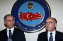 Turkish Interior Minister Efkan Ala (L) listens to French Interior Minister Bernard Cazeneuve during a joint press conference after their meeting in Ankara, on September 26, 2014