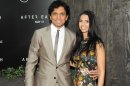 Director M. Night Shyamalan and his wife Bhavna attend the "After Earth" premiere at the Ziegfeld Theatre on Wednesday, May 29, 2013 in New York. (Photo by Evan Agostini/Invision/AP)