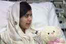 Pakistani schoolgirl, Malala Yousufzai, who was shot in the head by the Taliban for advocating girls' education, sits in her hospital bed in the Queen Elizabeth Hospital, in Birmingham