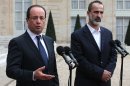 French President Francois Hollande, left, and head of the new Syrian National Coalition for Opposition and Revolutionary Forces Mouaz al-Khatib, right, give a press conference after a meeting, at the Elysee Palace, in Paris, Saturday, Nov. 17, 2012. French President Francois Hollande and the new Syrian opposition leader have announced plans to install a new ambassador to represent Syria in France. The announcement came after talks Saturday at the presidential palace in Paris between Hollande and Moaz al-Khatib, head of the newly formed Syrian opposition coalition. France is the only Western country to have formally recognized the group as the representative of the Syrian people. (AP Photo/Thibault Camus)
