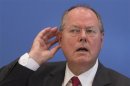 SPD top candidate in upcoming German general elections, Steinbrueck, gestures during news conference in Berlin