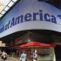 Tourists walk past a Bank of America banking center in Times Square in New York