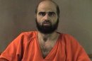 FILE - This undated file photo provided by the Bell County Sheriff's Department shows Nidal Hasan the Army psychiatrist charged in the deadly 2009 Fort Hood shooting rampage that left 13 dead. A report shows that Hasan, the Army psychiatrist charged in the deadly 2009 Fort Hood shooting rampage has the mental capacity to represent himself at his murder trial, but more information is needed about his physical condition, a judge said Wednesday, May 29, 2013, in delaying the suspect's request. (AP Photo/Bell County Sheriff's Department, File)
