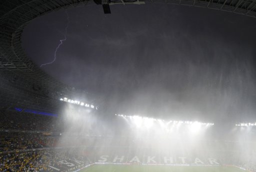 The lightning is seen on the sky above the Donbass Arena during the Group D Euro 2012 soccer match Ukraine vs France in Donetsk