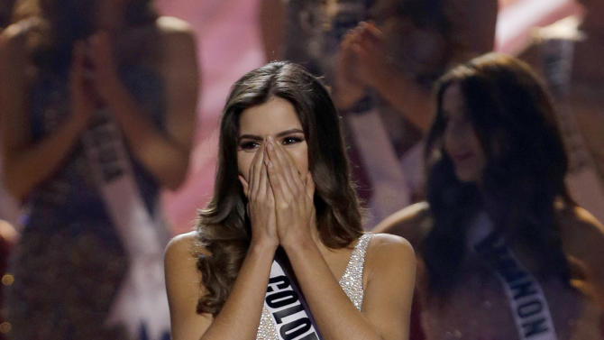 Miss Colombia Paulina Vega reacts after hearing she has become Miss Universe at the Miss Universe pageant in Miami, Sunday, Jan. 25, 2015. (AP Photo/Wilfredo Lee)