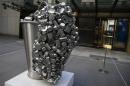 "Spill", a stainless steel vessel by Subodh Gupta is seen on display during ''The Spring 2-14 Sales of Asian Art Week" media preview at Christie's Auction House in New York