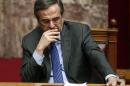 Greece's Prime Minister Samaras reacts during the second of three rounds of a presidential vote at the Greek parliament in Athens