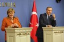 German Chancellor Merkel and Turkey's Prime Minister Erdogan attend a joint news conference in Ankara