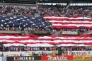 FILE - In this June 7, 2016, file photo, United States fans display the American flag during the national anthem before a Copa America Centenario group A soccer match between the United States and Costa Rica, at Soldier Field in Chicago. American soccer fans can watch a quintuple-header of major international tournament matches Saturday, the first of six in the next week-and-a-half. (AP Photo/Charles Rex Arbogast, File)