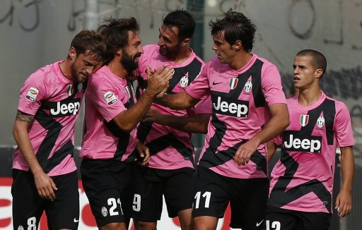 Juventus Pirlo is celebrated by his teammates Vucinic, De Ceglie , Marchisio and Giovinco during their Serie A soccer match against Siena in Siena