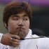 South Korea's Im Dong-hyun takes aim during the men's archery individual ranking round of the London 2012 Olympics Games at the Lords Cricket Ground in London