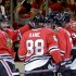 The Chicago Blackhawks celebrate a goal scored by Chicago Blackhawks center Patrick Sharp (10) against the Boston Bruins during Game 2 of the NHL hockey Stanley Cup Finals, Saturday, June 15, 2013, in Chicago. (AP Photo/Nam Y. Huh)