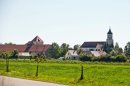 This picture taken Thursday, Sept. 5, shows the village of Klosterzimmern near Deiningen, Germany, which is one of the homes of the "Twelve Tribes" sect. Police say they have raided the Christian religious sect in Bavaria and taken 40 children from them on allegations that they were being physically abused. Bavarian police said Friday, Sept. 6, 2013, that the children of the sect were taken into protective custody the day before as investigators look into allegations that they were being beaten and otherwise physically punished. Authorities say 28 of the children were found at one of the sect's locations in the town of Deinigen, and 12 others in Woernitz. (AP Photo/dpa, Daniel Karmann)