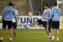 Uruguay's Luis Suarez (C) attends a training session with teammates at Amman International Stadium, on November 12, 2013, on the eve of their FIFA 2014 World Cup playoff match against Jordan