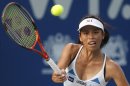 Hsieh Su-wei of Taiwan returns a shot against Petra Martic of Croatia during their final match at the WTA Malaysian Open tennis tournament in Kuala Lumpur, Malaysia, Sunday, March 4, 2012. (AP Photo/Lai Seng Sin)