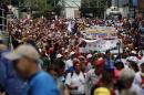 Elderly protesters take part in a march for peace in downtown Caracas