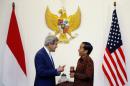 Indonesia's President Joko Widodo welcomes John Kerry to Jakarta