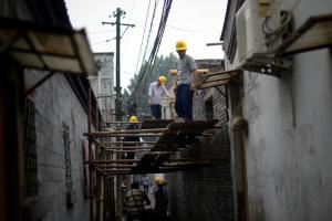 Workers build a house in an alley in Beijing on May&nbsp;&hellip;