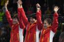 China's Ding Ning (L), Li Xiaoxia and Liu Shiwen celebrate as they recieve their gold medals in team table tennis during the Rio 2016 Olympic Games